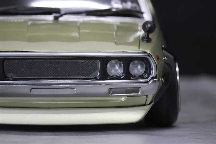 Close-up front view of the Pandora RC KPGC110 Skyline 2000GT-R Kenmeri body shell, showcasing the detailed grille, headlights, and fender mirror.