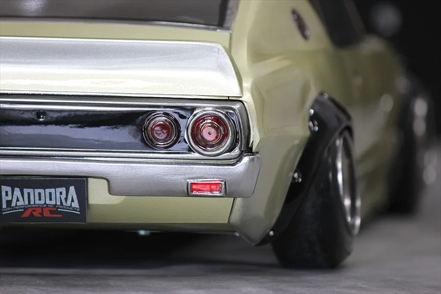 Close-up rear view of the Pandora RC KPGC110 Skyline 2000GT-R RC car body showcasing taillights, fender flare, and Pandora RC license plate.