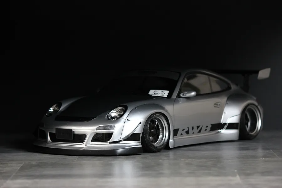 Pandora RC RWB 997 Type silver drift RC car body shell with black accents, wide fenders, and RWB decals.