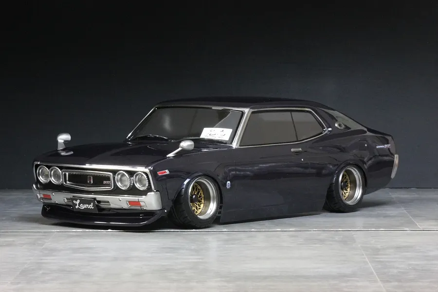 Pandora RC C130 Laurel RC body shell painted dark purple with chrome trim and custom wheels.