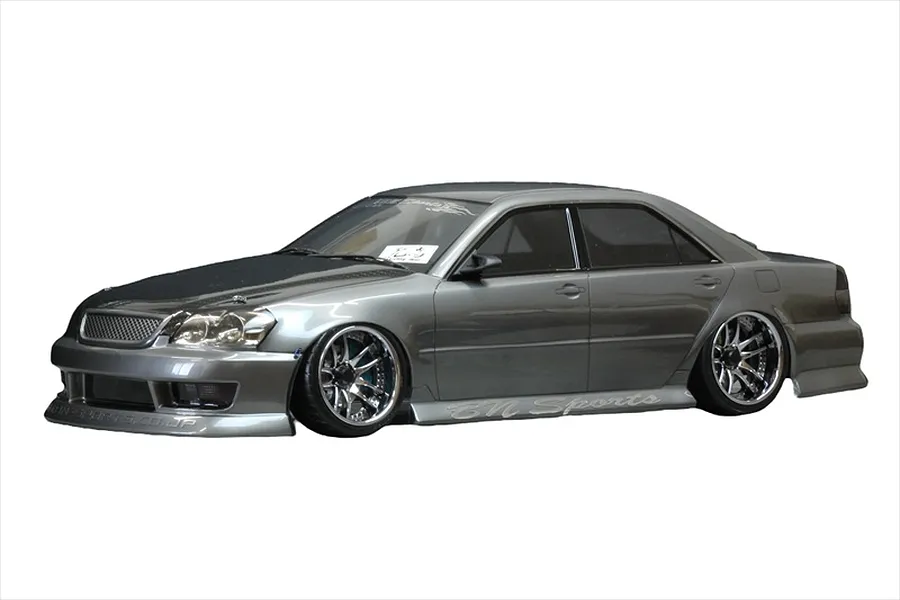 A grey RC drift car body styled as a Toyota Mark II JZX110 with BN Sports body kit and custom wheels on a white background.