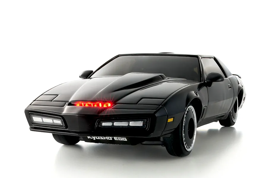 Kyosho Mini-Z Knight Rider RC car in black with illuminated red scanner light on the front grill, presented on a white background.