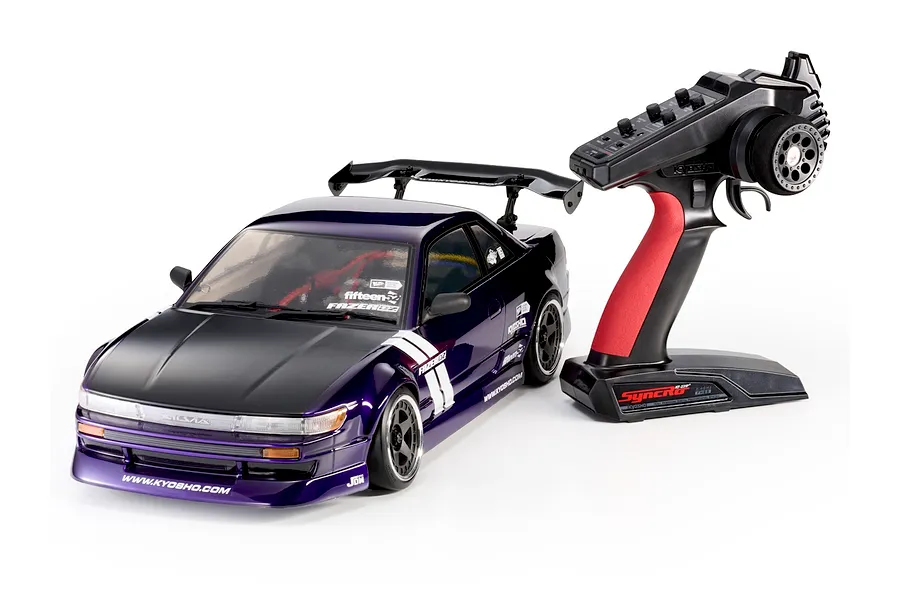 Kyosho Fazer D2 Nissan S13 Silvia 1/10 scale purple RC drift car shown with its black and red transmitter on white background.