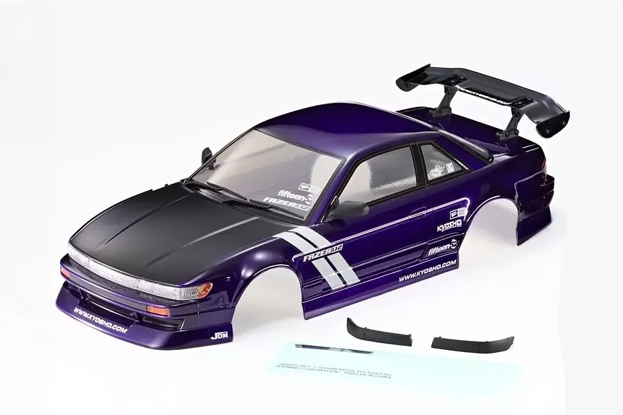 Purple and black Nissan S13 Silvia RC drift car body shell with rear wing and decals on a white background.