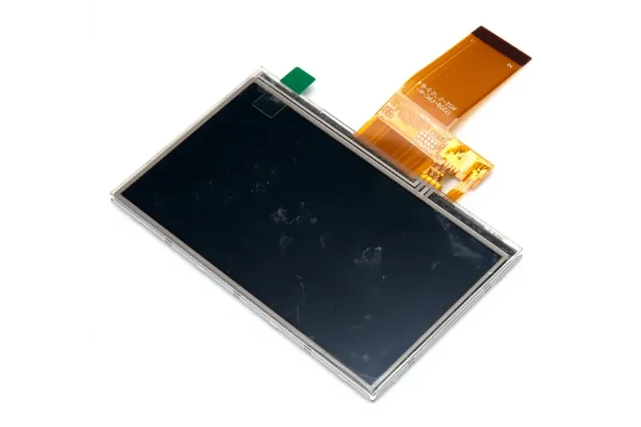Futaba replacement LCD screen with an attached ribbon cable shown against a plain white background.