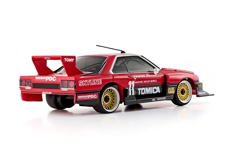 Rear-three-quarter studio view of the Kyosho First Mini-Z 1982 Nissan Super Silhouette RC car in red with black trim and gold mesh wheels.