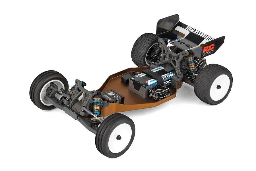 Top down studio shot of an assembled 1/10 scale 2WD electric RC buggy chassis featuring a brown aluminum tub chassis, electronics, and white wheels.