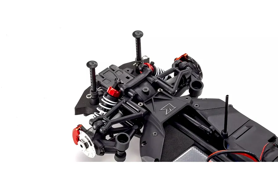 Close-up studio shot of the front suspension and chassis components of the Kyosho Fazer MK2 RC car.
