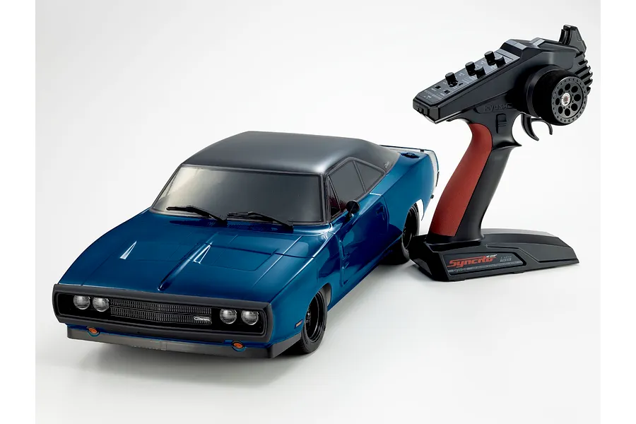 Kyosho 1970 Dodge Charger RC car in blue with black roof and its accompanying pistol grip transmitter on a white background.