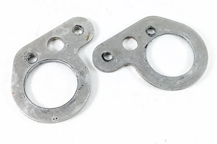 Two silver metal rear suspension arm stopper plates for Tamiya RC cars displayed on a white background.