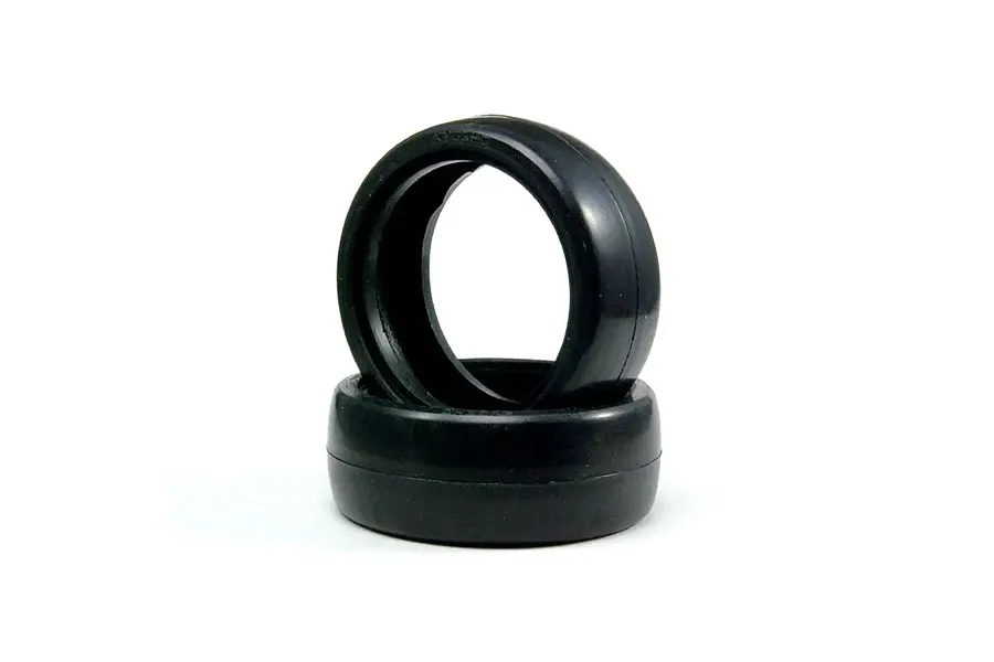 Two black slick rubber RC touring car tyres stacked on a clean white background.