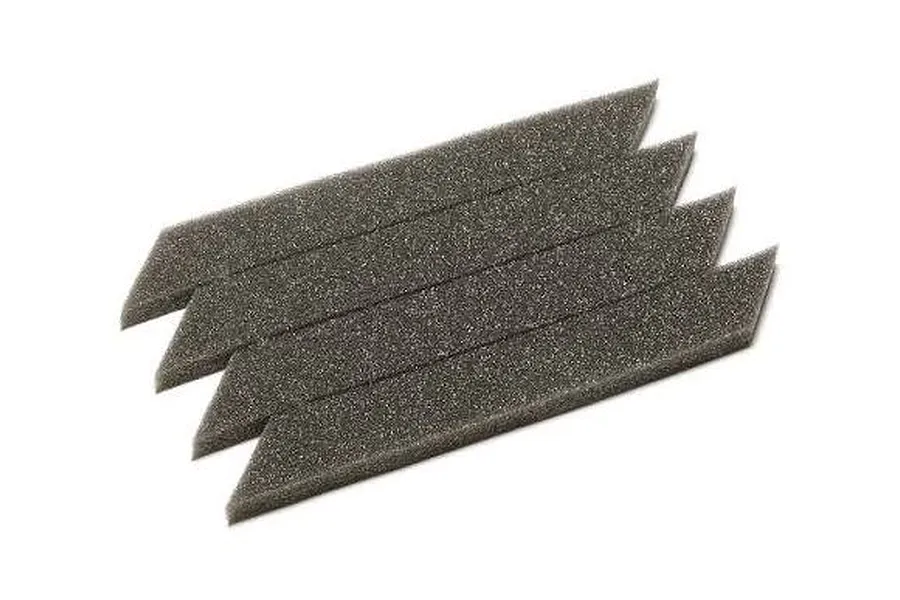 Four grey foam strips arranged diagonally on a white background for RC tyres.