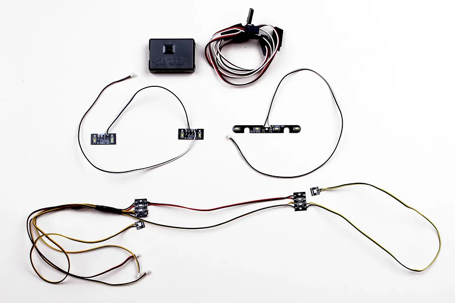 Killerbody LED light set with control box, wiring harnesses, and circuit boards featuring LEDs laid out on a white background.
