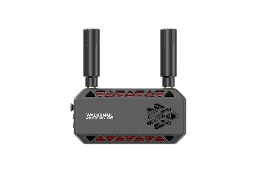 CaddxFPV Walksnail Ascent VRX Pro video receiver module with two antennas attached against a dark background.
