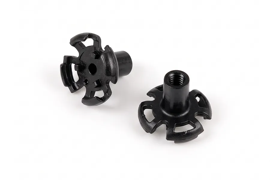 Two black molded plastic propeller claw plates for an FMS RC mini plane displayed on a plain white background.