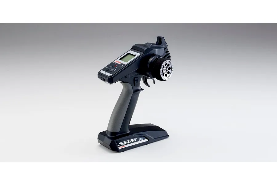 Kyosho Syncro KT-331P 2.4GHz 3-channel RC transmitter shown from an angled studio view against a neutral white background.