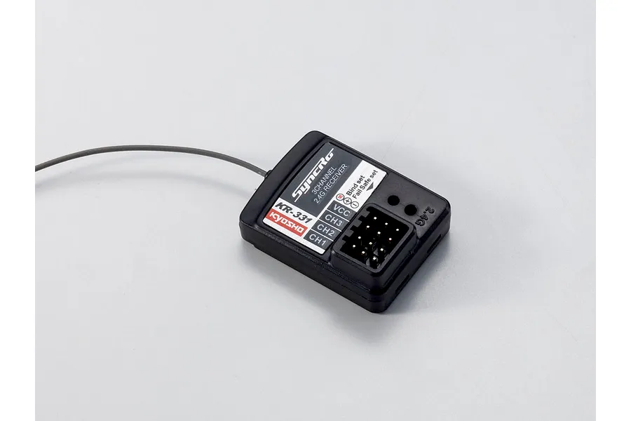 Kyosho KR-331 3-channel 2.4GHz RC receiver on a plain white background, showing plug pins and wire antenna.
