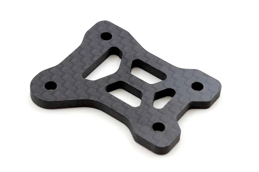 Kyosho carbon fibre centre diff plate shown from an angled top view against a plain white background.