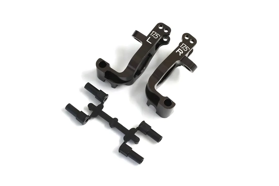 Kyosho aluminium steering hub carriers in gunmetal with associated plastic parts on a white background.
