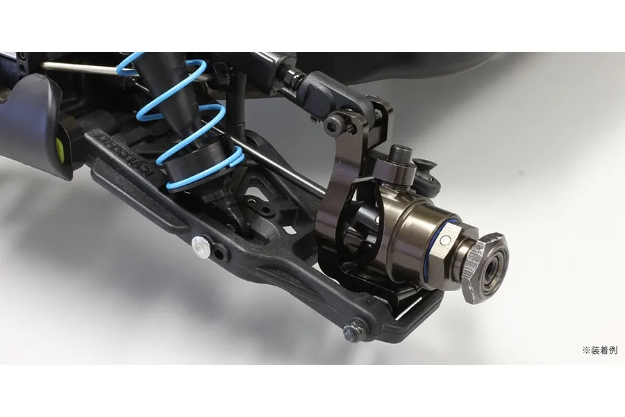 Kyosho aluminium steering hub carrier installed on the front suspension of an RC model car.