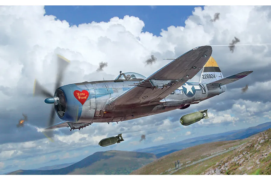 Box art painting of a P-47D Thunderbolt fighter aircraft in flight dropping bombs over a mountainous landscape with cloudy skies.