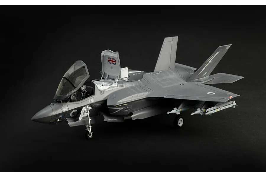 Completed Italeri 1/48 F-35B Lightning II plastic model aircraft with landing gear down and canopy open against a dark background.