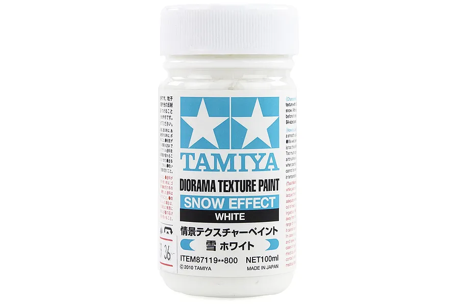 A 100ml jar of Tamiya Snow Effect diorama texture paint featuring a white screw-top lid and a label with the Tamiya logo and product details.