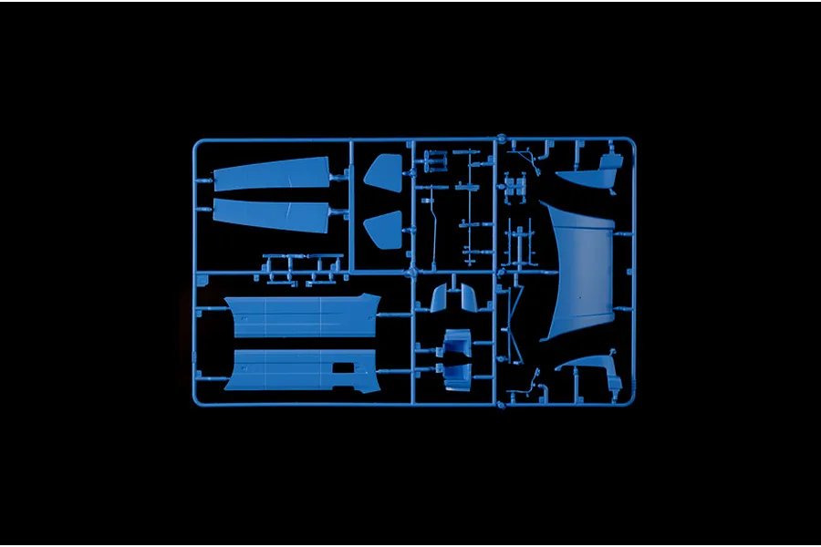 Blue plastic model sprue featuring various body panels and parts for the Italeri Volvo FH truck model kit.