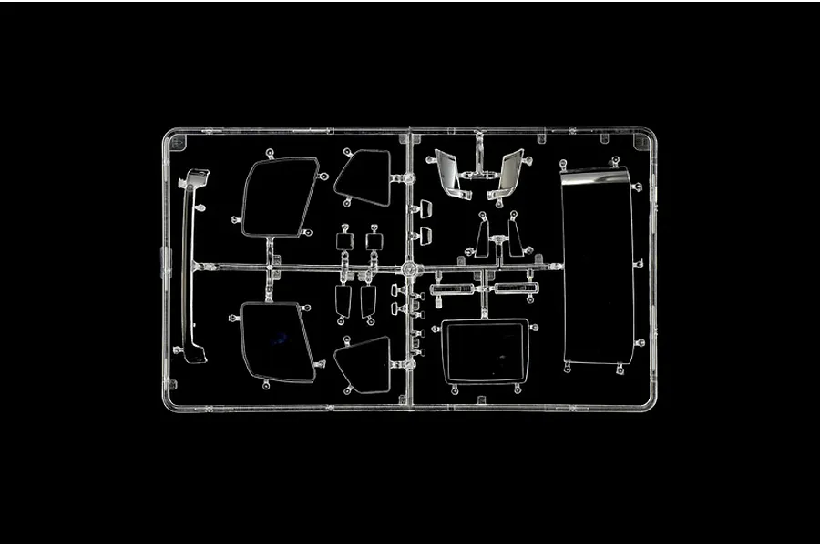 Clear plastic parts sprue featuring transparent windows and mirrors for the Italeri 1/24 Volvo FH truck model kit.