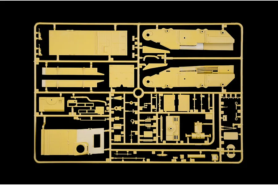 Tan plastic model kit sprue containing various unbuilt vehicle parts and panels against a black background.
