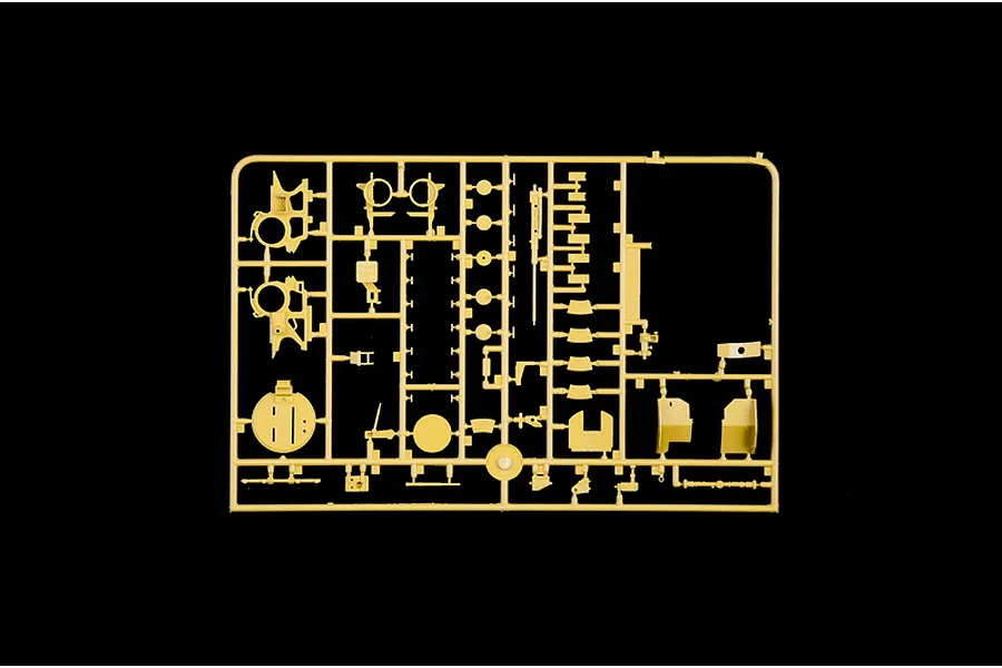 Tan plastic model kit sprue containing various unbuilt parts and components on a black background.