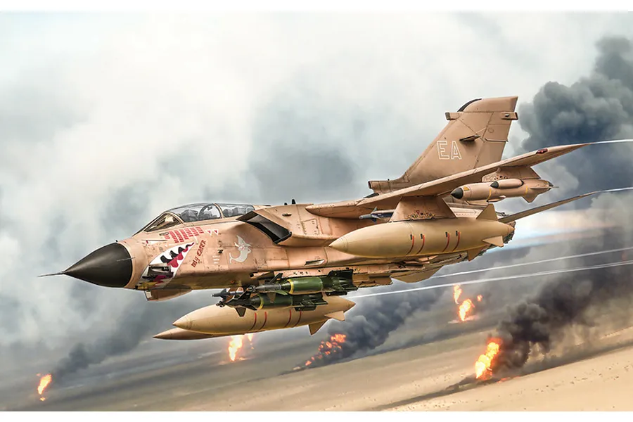 Completed Italeri 1/32 scale Tornado GR.1 military jet model in desert camo flying over a smoky battlefield diorama background.