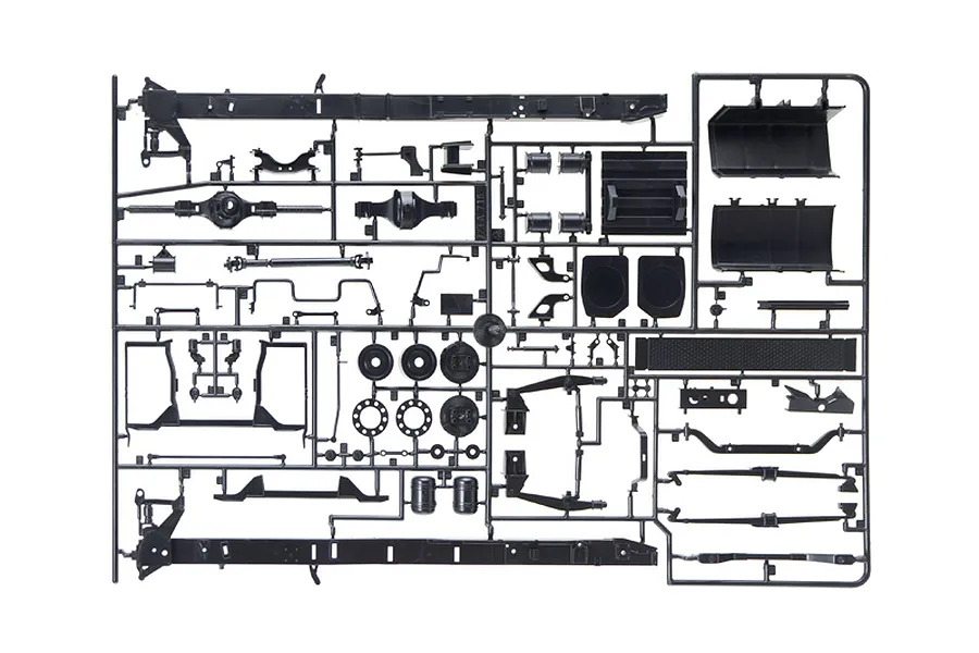Black plastic model kit sprue containing various truck chassis parts, axles, and components against a white background.