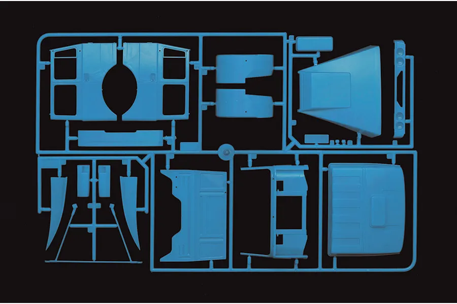 Light blue plastic model kit sprue featuring truck cab body panels and components against a black background.