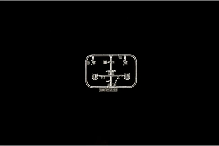 Clear plastic model kit sprue containing canopy parts and cockpit components on a black background.