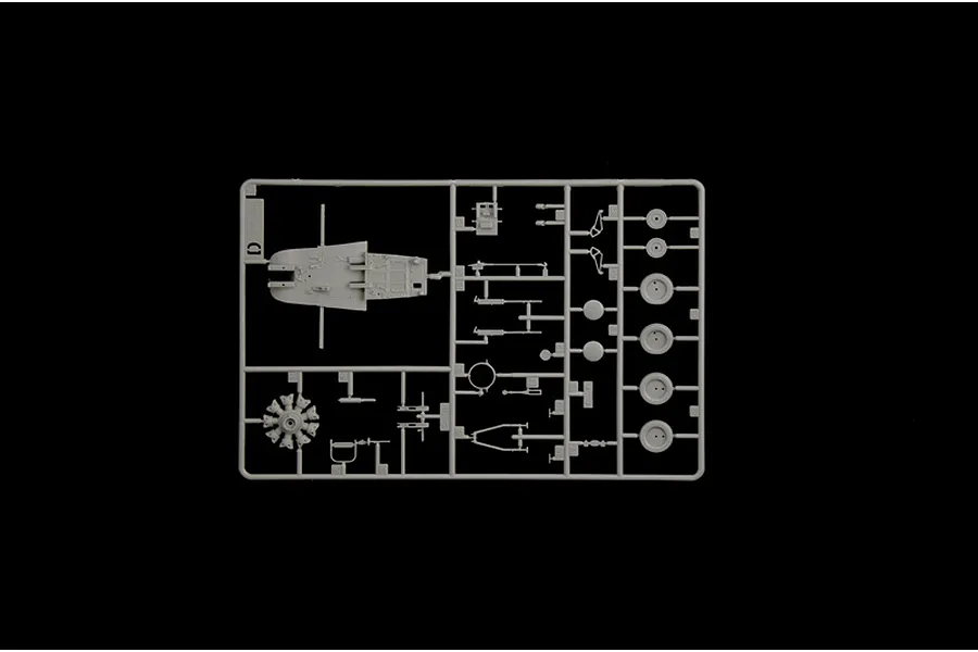 A grey plastic model kit sprue containing interior cockpit parts, radial engine, and wheels against a black background.
