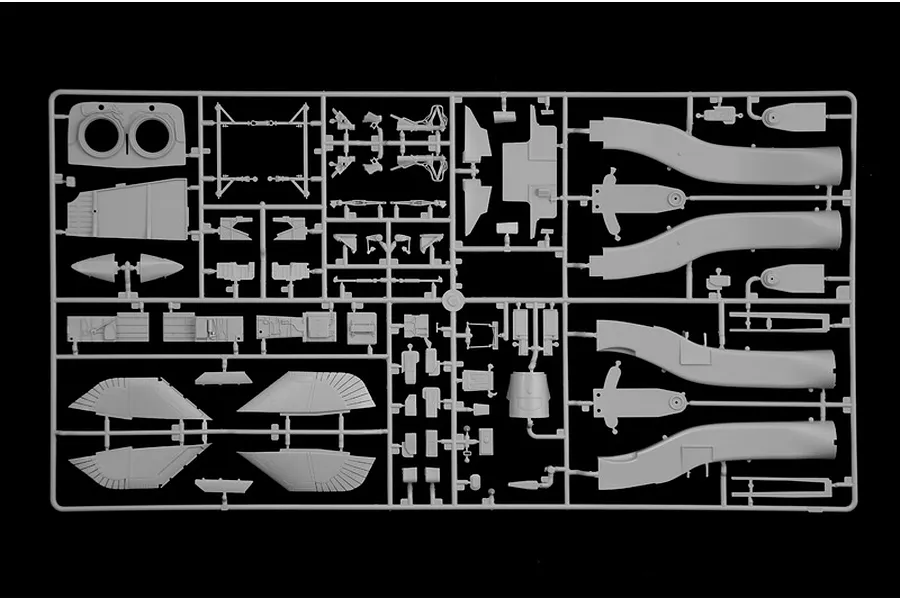 Grey plastic model kit sprue containing various aircraft parts against a black background.