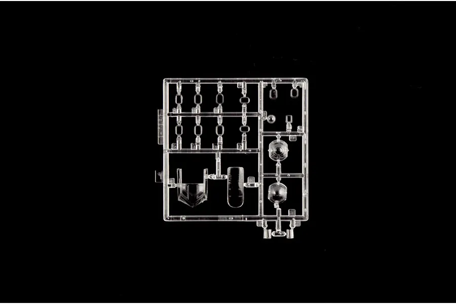 Clear plastic model kit sprue containing transparent canopy and window parts on a black background.