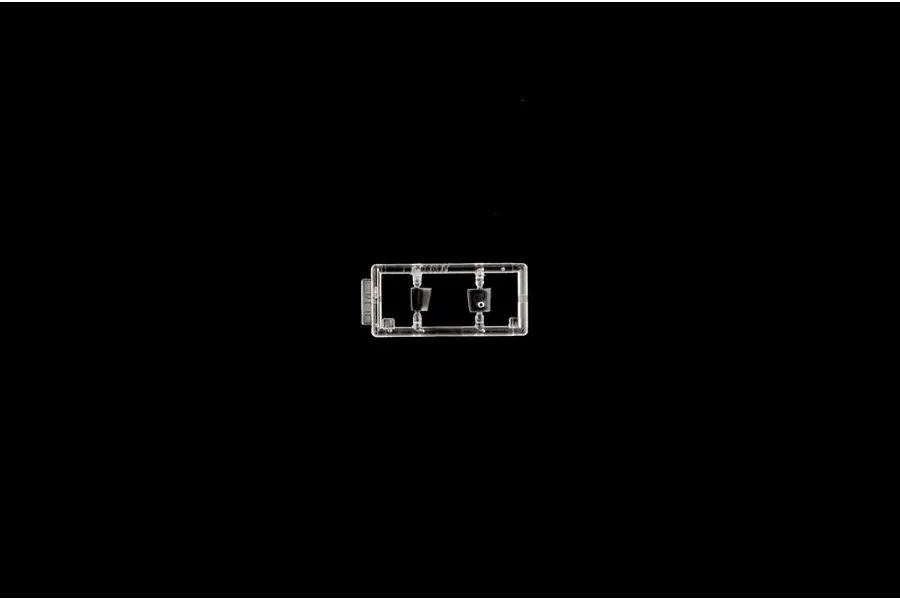 Clear plastic model sprue piece featuring small transparent components against a black background.