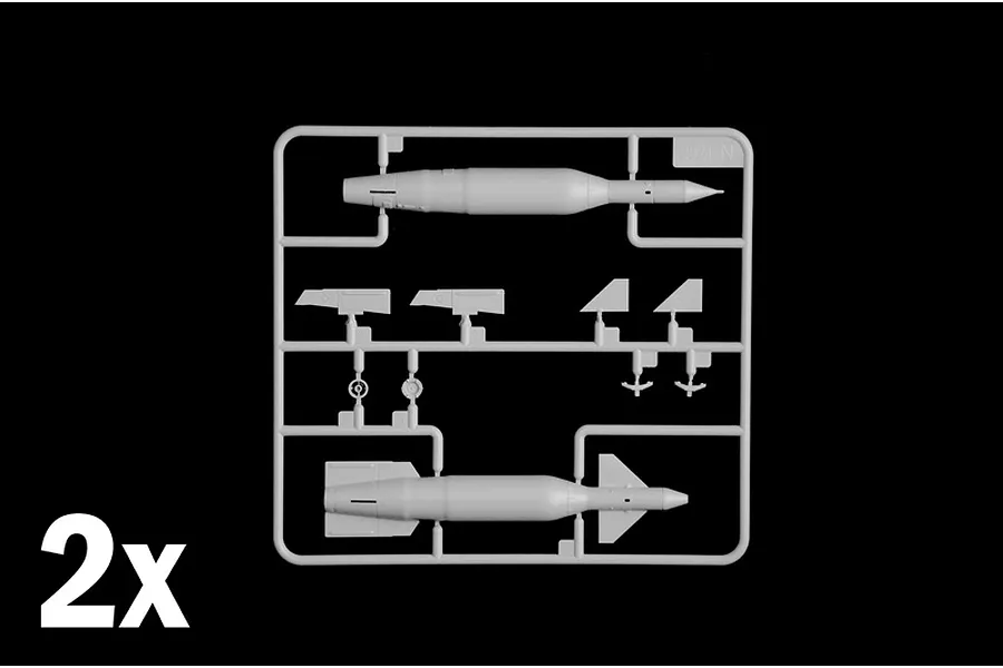 Grey plastic model kit sprue showing ordnance parts like missiles and bombs, with a 2x indicator in the corner.
