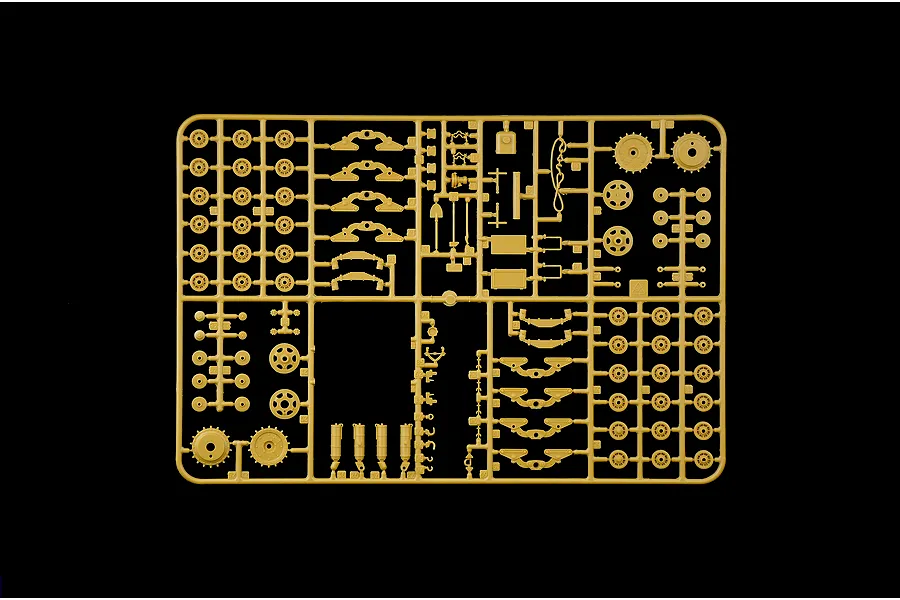 Tan plastic model kit sprue containing various tank suspension components, wheels, and small parts on a black background.