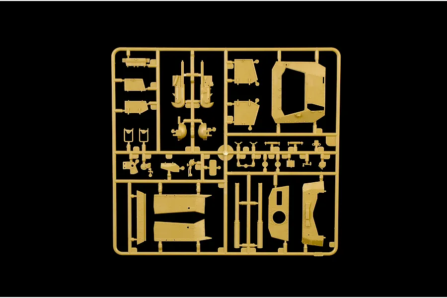 Tan plastic model kit sprue containing various unbuilt tank armor and chassis parts against a black background.