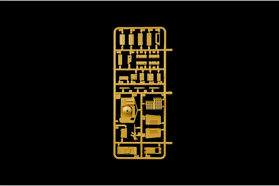 Tan plastic model kit sprue containing various parts and components on a solid black background.