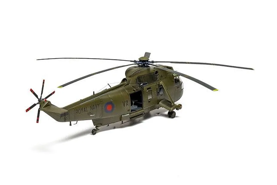 Completed Airfix 1/48 scale model of a Royal Navy Westland Sea King HC.4 helicopter in olive green livery against a white background.