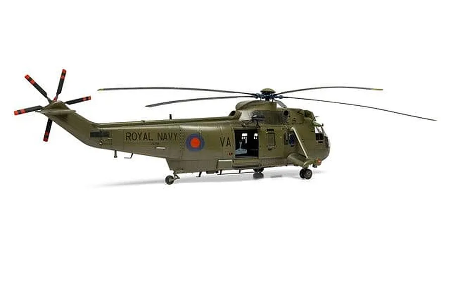 A completed and painted 1/48 scale model of a Royal Navy Westland Sea King HC.4 helicopter in olive green livery.