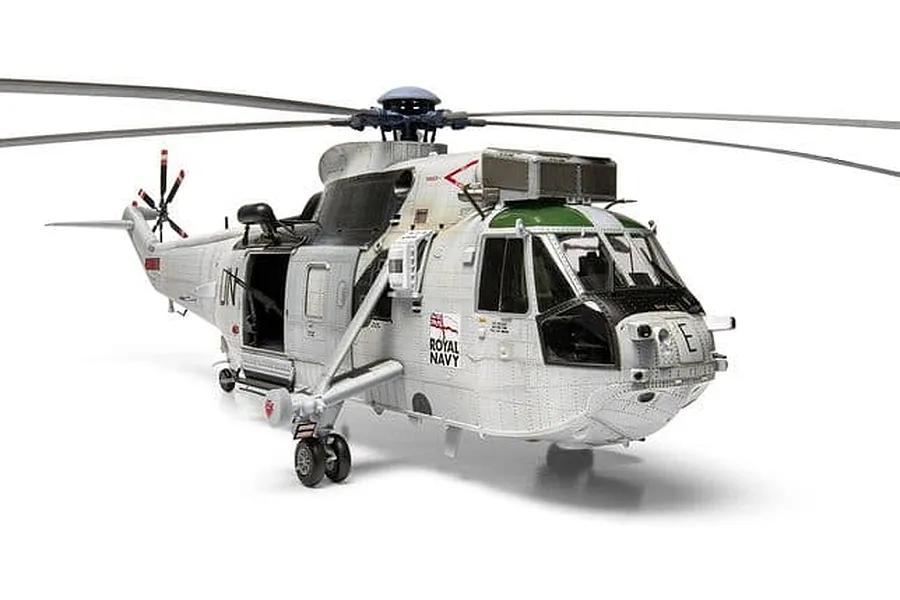Completed Airfix 1/48 scale model of a Royal Navy Westland Sea King HC.4 helicopter in white and green camouflage against a plain white background.