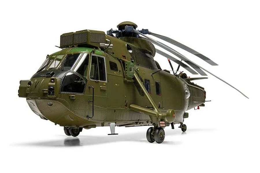 A studio shot of the Airfix 1/48 scale Westland Sea King HC.4 plastic model helicopter finished in military green livery against a white background.