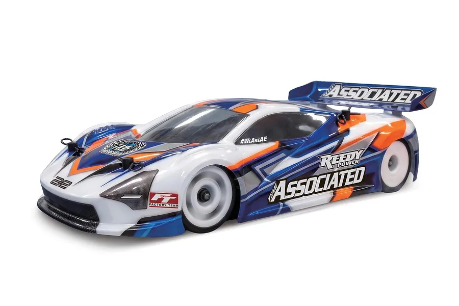 Team Associated RC car with blue, white, and orange body shell and rear wing on a white background.