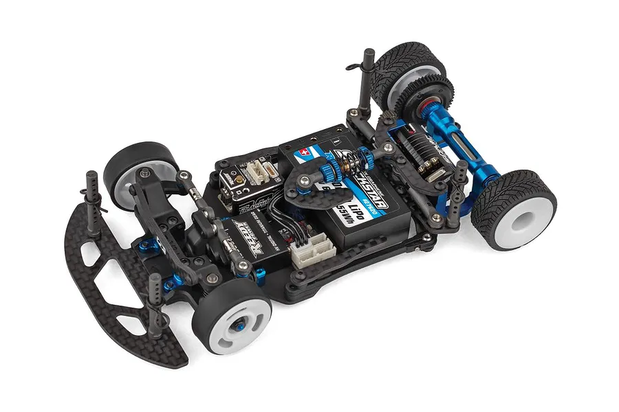 Studio product shot of the RC car chassis, showing carbon fiber and blue anodized aluminum parts on a white background.