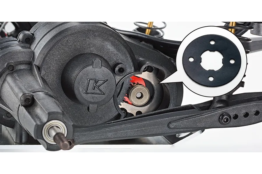 Close-up of the RC car transmission housing with an inset callout showing a gasket or spacer component.
